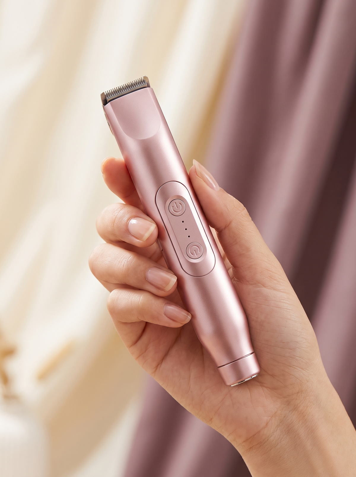 Vella trimmer held in hand showing its compact size